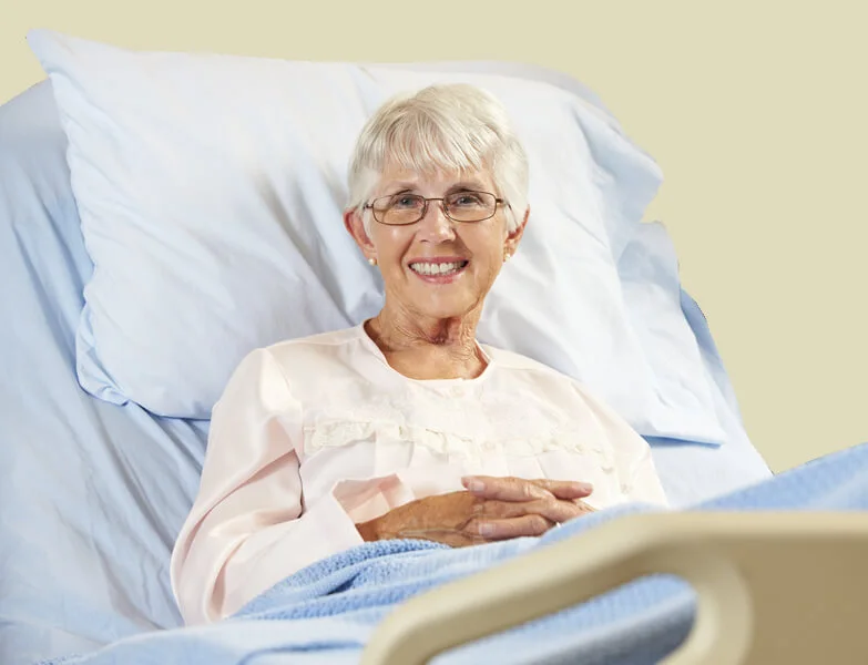 elderly woman in an Electric bed
